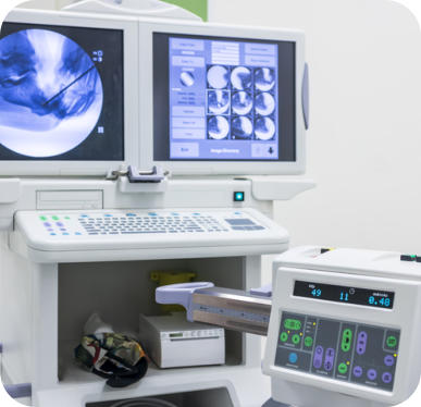 A fluoroscopy machine shows images of an arthrography procedure.