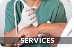 A medical technician uses an ultrasound wand on the wrist of a patient. This link goes to the orthopedic services page.