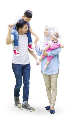 A young family is walking together: the mom carries a baby in her arms as she smiles up at the young boy on his father's shoulders.