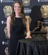 Lindsay Braddock posing with her award at a NC Athletic Trainers Association event