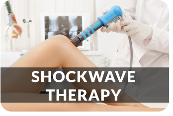 A patient lies on a treatment table while a physician applies shockwave treatments to her knee