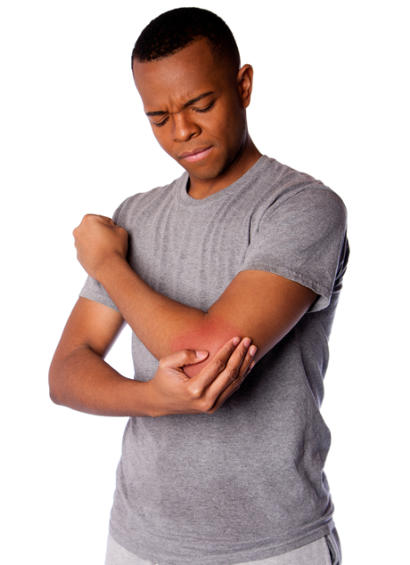 A young man is grimacing and holding his elbow in pain.