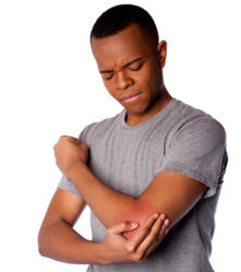 A young man is grimacing and holding his elbow in pain.