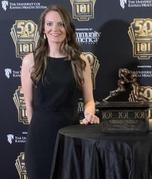 Lindsay Braddock posing with her award at a NC Athletic Trainers Association event